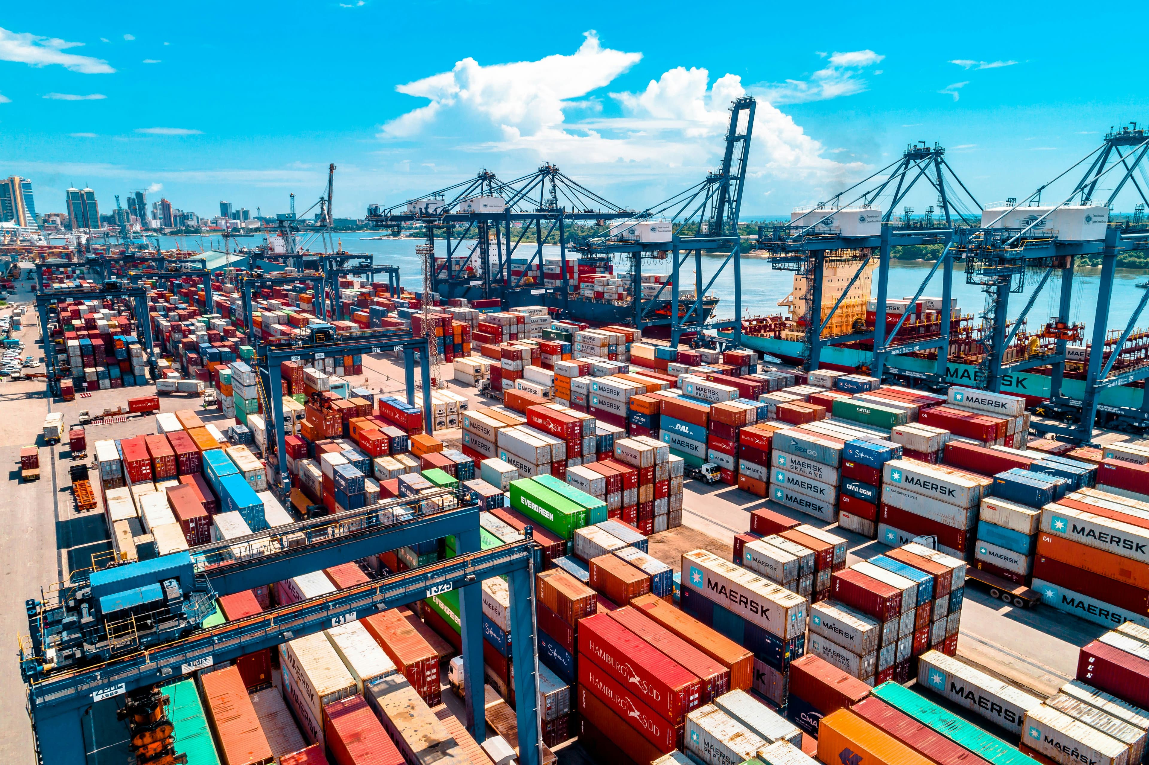 a large amount of containers are stacked on top of each other